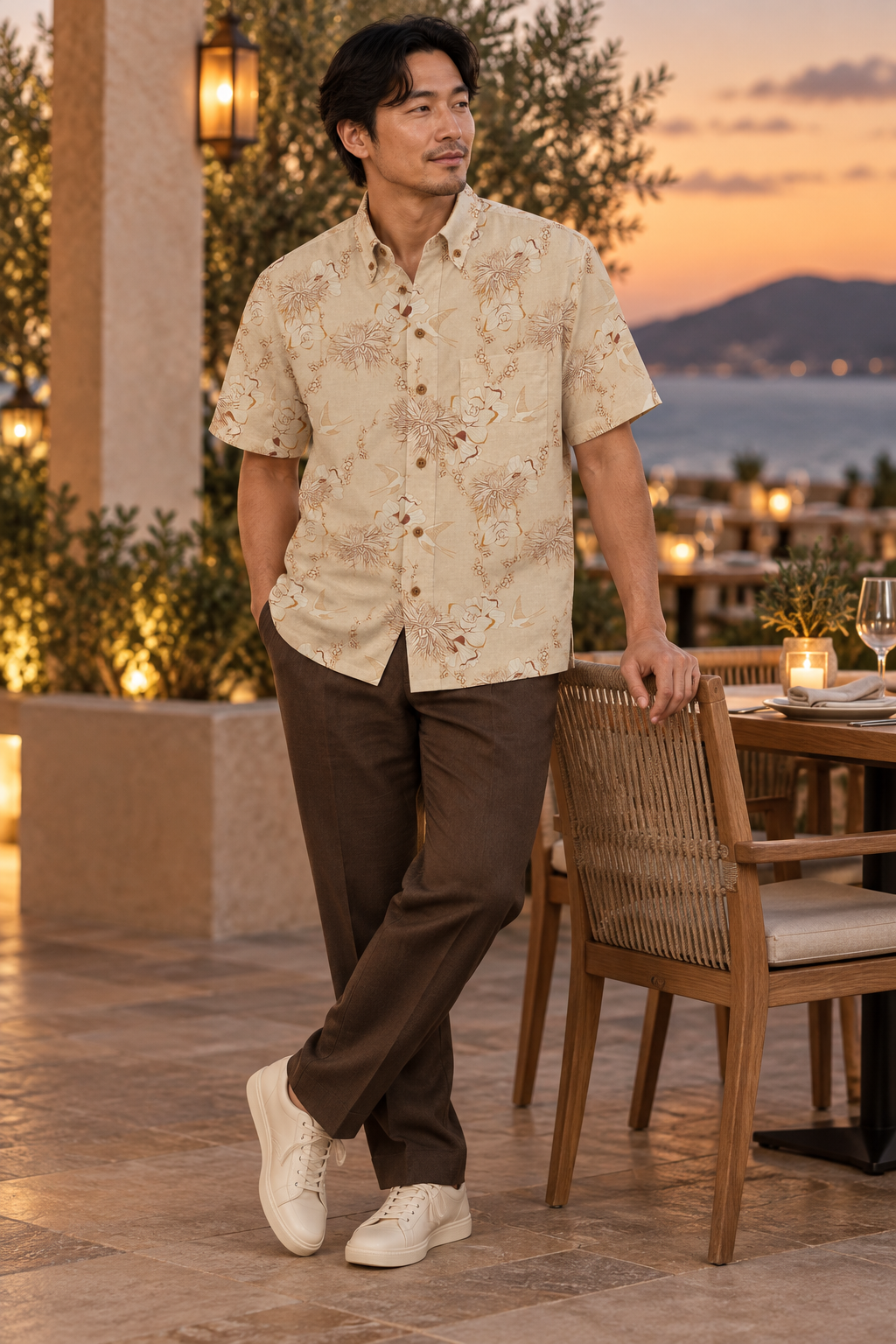 Man wearing the Ivory Swallow Garden Resort Shirt at golden hour