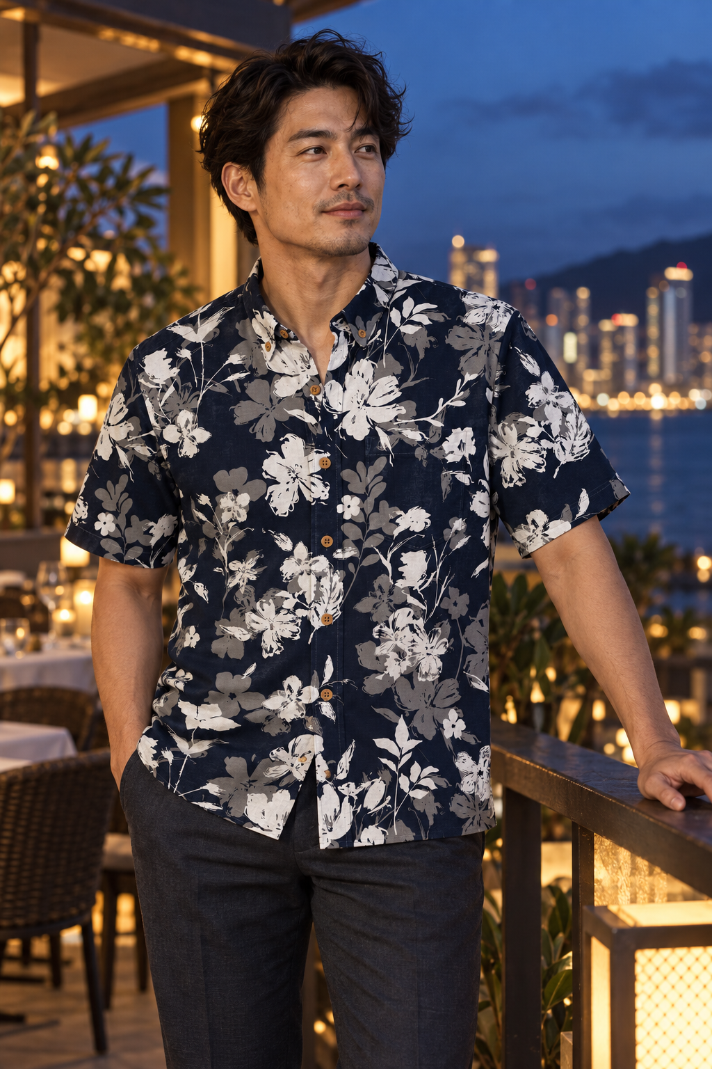 Man wearing the Midnight Brush Garden Resort Shirt at an evening terrace